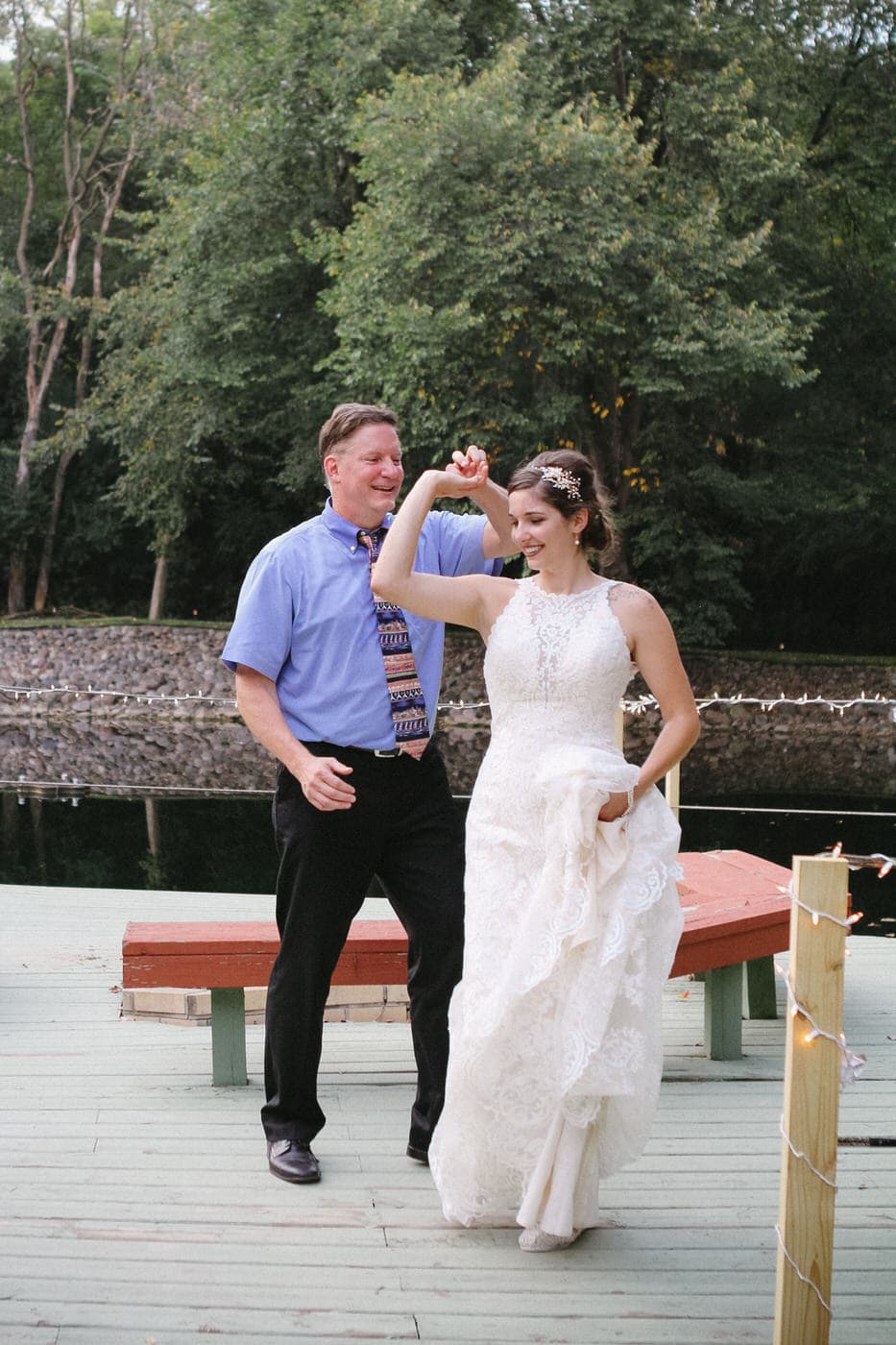 Outdoor father daughter dance by a pond