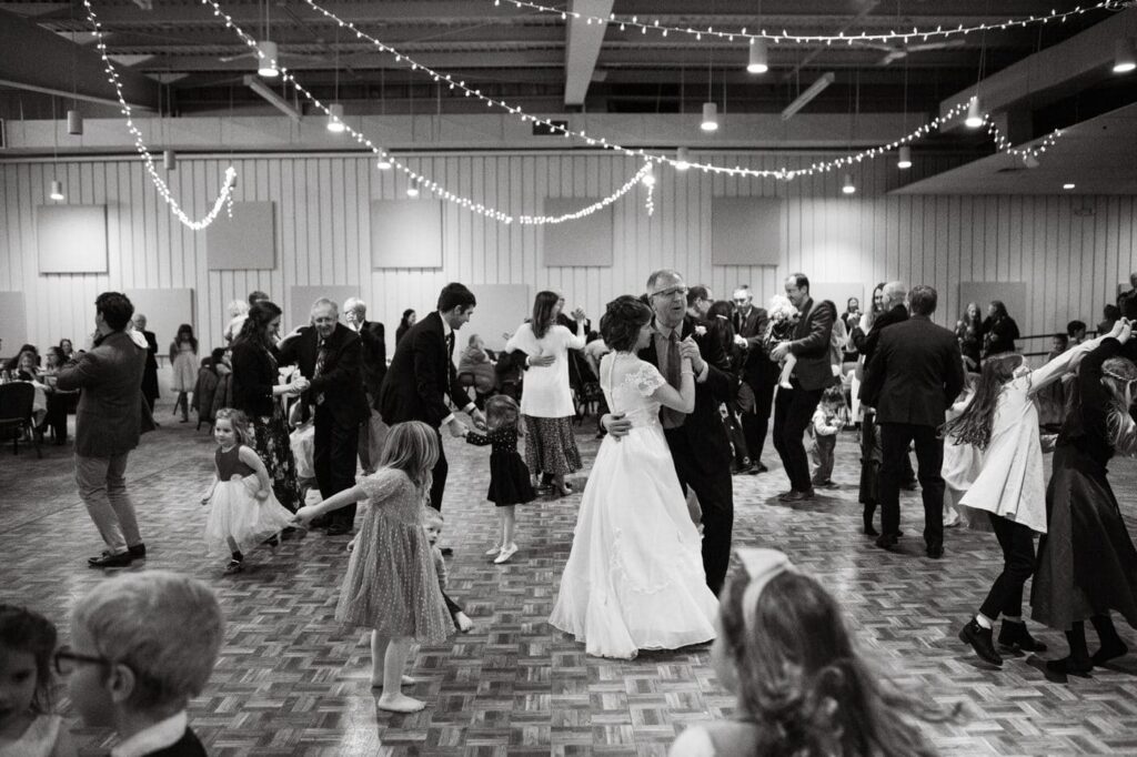 other father daughter pairs join the bride and her father on the dance floor