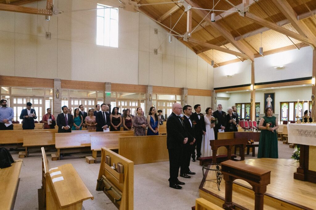 wide angle view of guests at a wedding mass